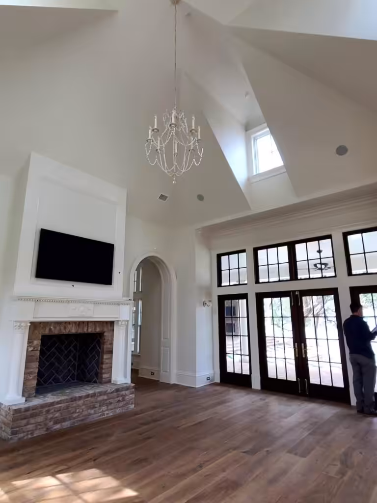 Spacious living room with fireplace showcasing premium interior painting