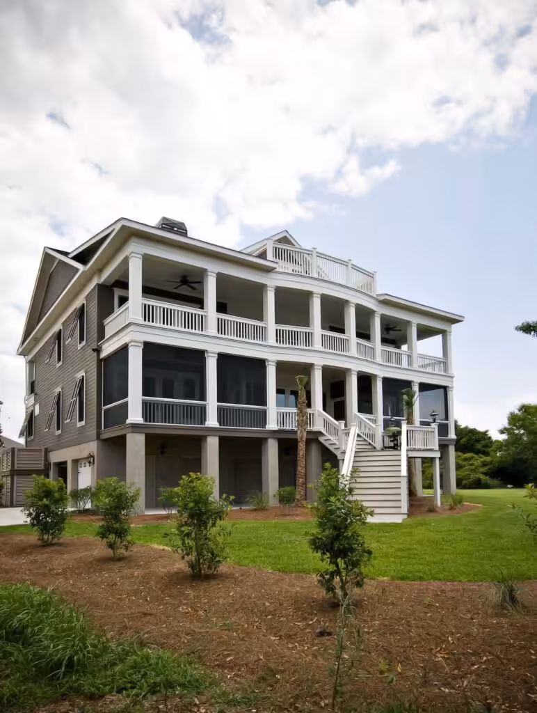 Wood Rot Repair Before Painting: Fix the Water, Then the Wood, Then Paint Rear of a three-story coastal home on Kiawah Island with stacked porches, white railings and exterior stairs